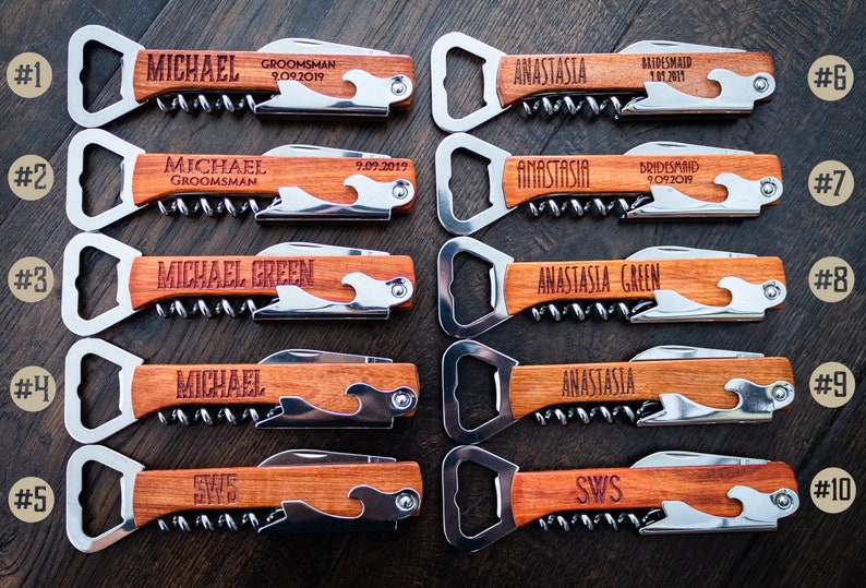 May include: A collection of personalized wooden bottle openers and corkscrews. Each tool features a stainless steel opener, corkscrew, and knife, with custom engraved names and dates. The wooden handles have a wave design.