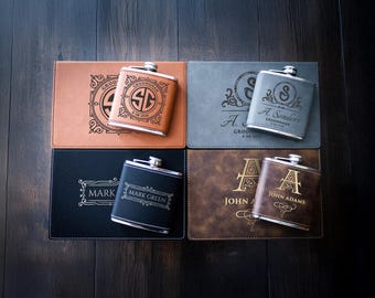 May include: Four personalized leather-wrapped flask sets with engraved initials and names. Each set includes a silver flask and a brown, black, or gray leather case.
