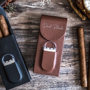 Personalized cigar case and cutter.