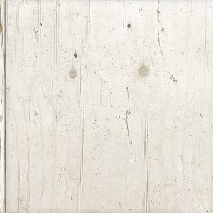 May include: A whitewashed wood panel with a rustic, weathered texture. The panel is framed by two vertical strips of wood, creating a border.