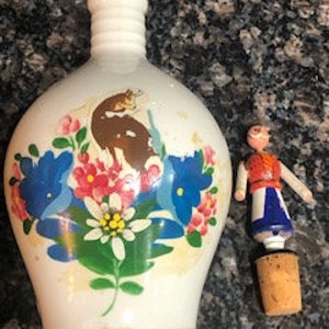 German Peach Apricot Liqueur Bottle with unique figurine stopper  vintage - collectible