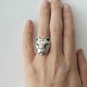 Lioness ring with blue diamond eyes and pink sapphire nose