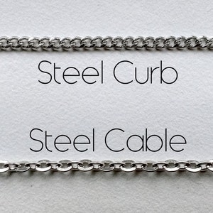 May include: Two silver chains, one labeled "Steel Curb" and the other labeled "Steel Cable".