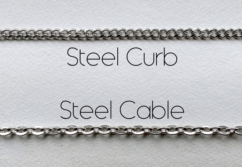 May include: Two silver chains, one labeled "Steel Curb" and the other labeled "Steel Cable".