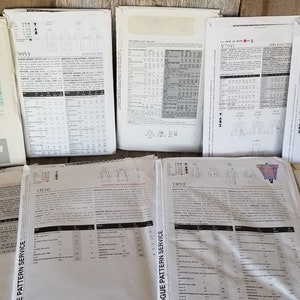May include: A collection of vintage sewing patterns for various garments, including dresses, tops, and jackets. The patterns are printed on white paper with black text and illustrations. The patterns are in various sizes and styles.