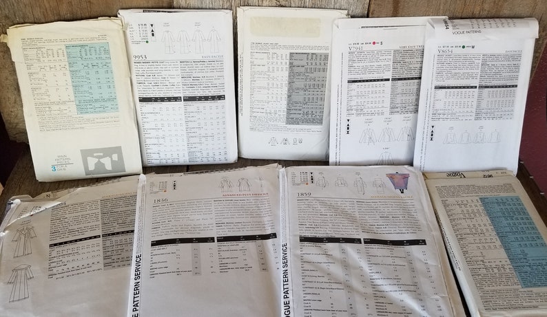 May include: A collection of vintage sewing patterns for various garments, including dresses, tops, and jackets. The patterns are printed on white paper with black text and illustrations. The patterns are in various sizes and styles.