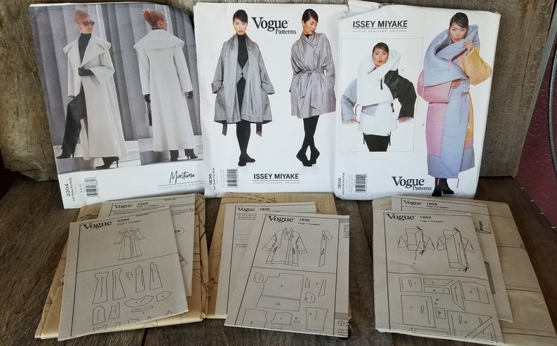 May include: A collection of vintage sewing patterns for coats and jackets. The patterns are from Vogue and Issey Miyake. The patterns are in various sizes and styles. The patterns are in good condition.