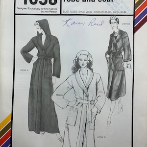 May include: Vintage sewing pattern for a hooded and shawl-collar robe and coat, Stretch & Sew 1058. The pattern includes illustrations of the robe and coat designs, with bust sizes ranging from small to large. Designed for knit fabrics.