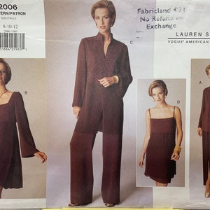 May include: A white ceramic mug with a black handle and the text "But first, coffee" in a handwritten style. The mug is on a white surface. Suitable for hot drinks.