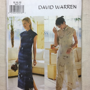May include: A Butterick sewing pattern envelope showing two women in David Warren designs. The pattern includes a dark blue, floral-print dress and a cream-coloured, floral-print top and trousers set. The envelope has the number 6057 and the Butterick logo.