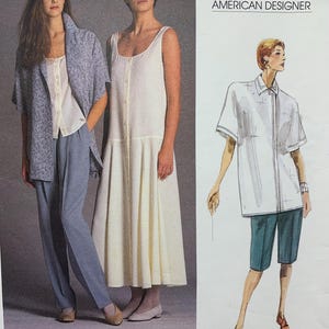 May include: Vogue Patterns American Designer pattern with three fashion illustrations. Designs include a button-down dress, a short-sleeved shirt with shorts, and a jacket with trousers. The pattern number is 1856.