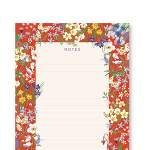 May include: A rectangular notepad with a red floral border. The notepad has a cream-coloured interior with lined pages and the word "NOTES" at the top. The floral border includes white, yellow, blue, and purple flowers.