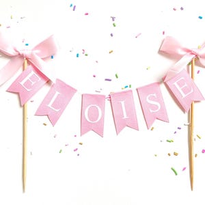 Custom Personalized Name Baby Pink Cake Bunting Flag Topper w/ Bows - Birthday Cake Smash Princess Tea Girly Pink White Purple Blue Coquette