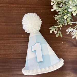May include: A rustic wooden sign with the text "Welcome to our home" in white lettering. The sign features a distressed finish and a simple, inviting design, perfect for front door decor.