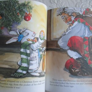 May include: A white bunny wearing a green and white striped scarf holds a Christmas Easter egg with a red and white design. The bunny is standing next to a Christmas tree with a red ornament. The text reads: "The bunny whipped out a Christmas Easter egg, or a Easter Christmas egg, from the pocket of his clean white jacket. What a wonder it was!"