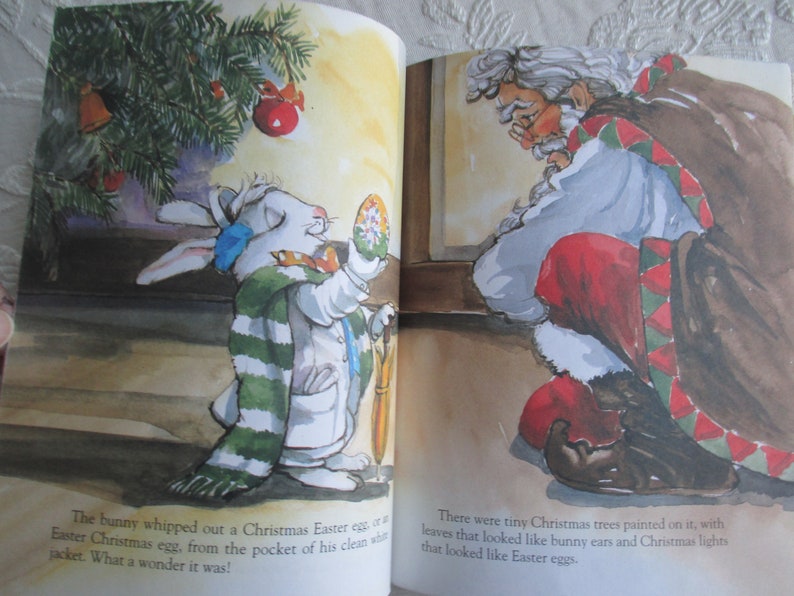 May include: A white bunny wearing a green and white striped scarf holds a Christmas Easter egg with a red and white design. The bunny is standing next to a Christmas tree with a red ornament. The text reads: "The bunny whipped out a Christmas Easter egg, or a Easter Christmas egg, from the pocket of his clean white jacket. What a wonder it was!"