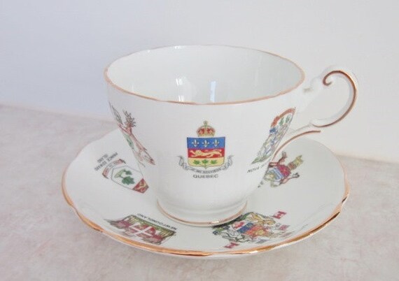 This wonderful Royal Darwood china tea cup set decorated with Canadian Prov...