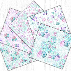 May include: A set of four digital paper designs featuring a winter holiday theme. The papers feature a white background with pastel blue, pink, and purple watercolor illustrations of macarons, presents, and snowflakes. The text "Happy Holidays" is written in a cursive font on one of the papers.