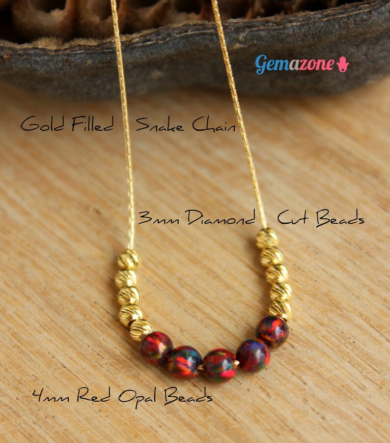 May include: Gold filled snake chain necklace with 3mm diamond cut beads and 4mm red opal beads.