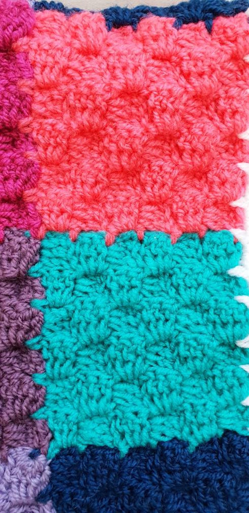 Handmade multi coloured patchwork crocheted baby blanket