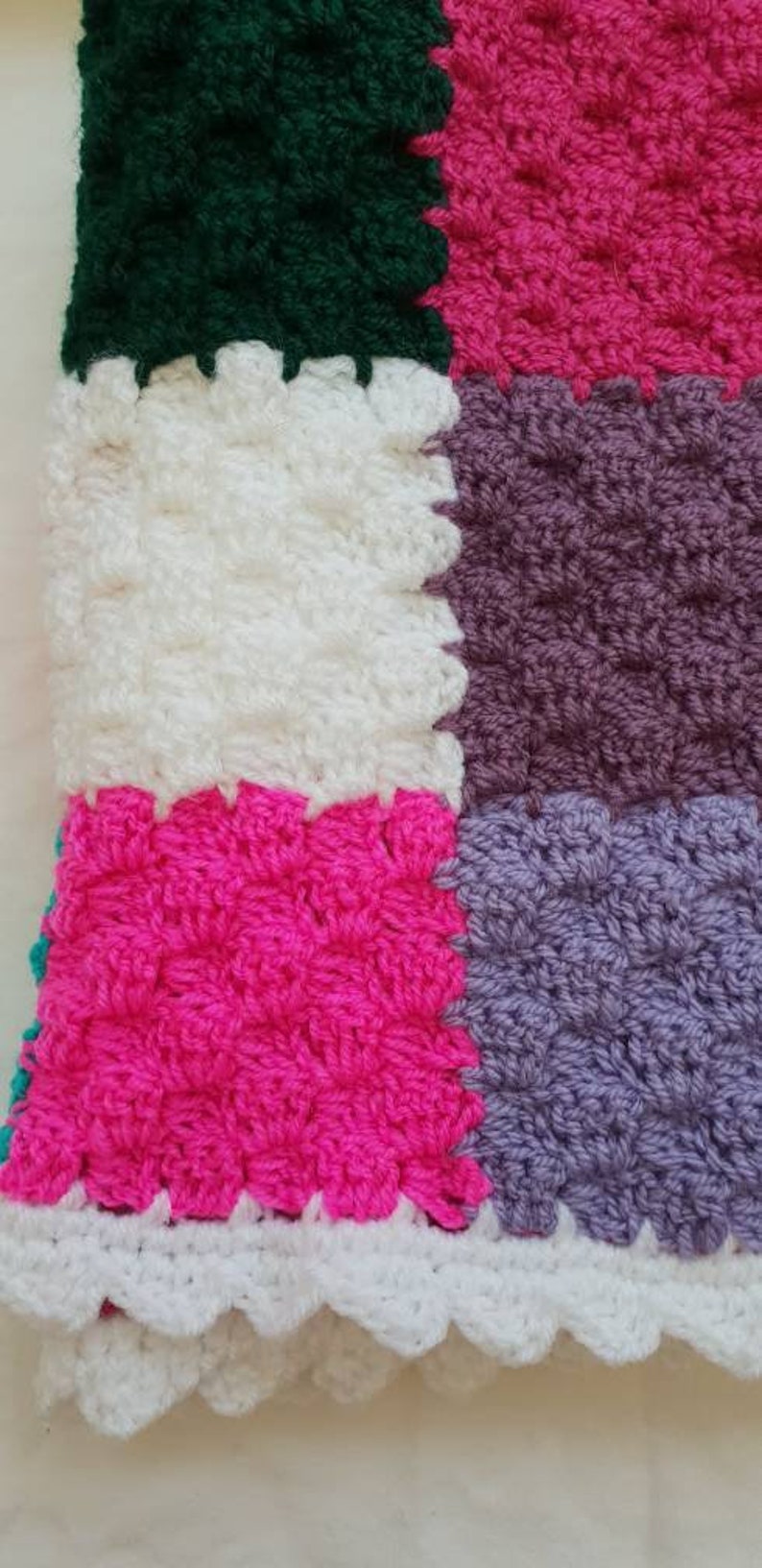 Handmade multi coloured patchwork crocheted baby blanket