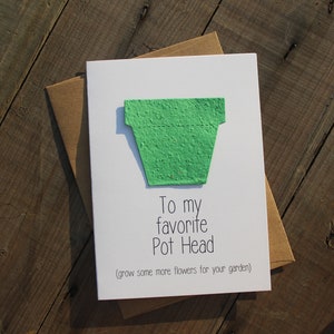 May include: A white card with a green paper pot shape on it. The card says "To my favorite Pot Head (grow some more flowers for your garden)"