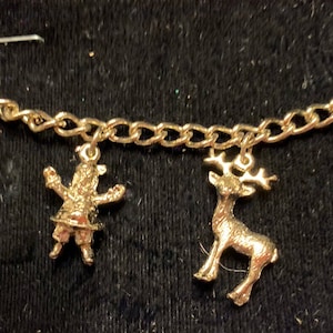 Merry Christmas Santa with reindeer, North Pole sign and Elf Charm bracelet