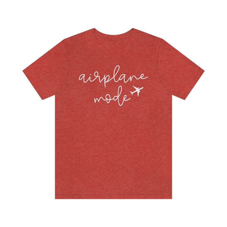May include: Red heather t-shirt with white text that reads "airplane mode" and a small airplane graphic.