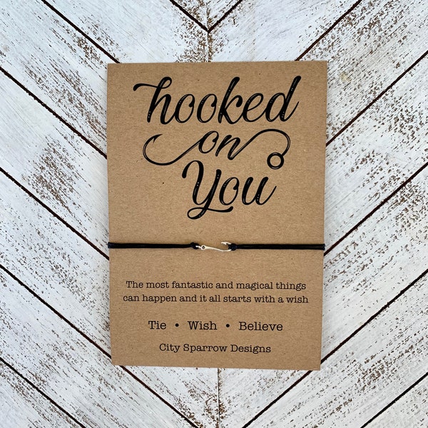 Hooked on You Quote Wish Bracelet on a 1mm wax cotton cord. Includes 20mmx5mm zinc alloy or copper tone charm on a card. Love, valentine