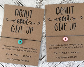 Donut Wish Bracelet on a 1mm wax cotton cord. Includes a hand painted, enamel donut charm blue or pink frosting. Donut give up keepsake card
