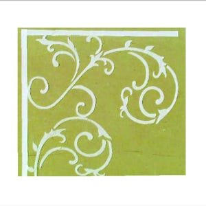 May include: A decorative stencil design featuring white, swirling floral patterns on a light green background. The design is framed by a white border, creating a corner motif suitable for various craft projects.