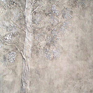 May include: A textured, monochromatic artwork featuring a detailed relief of a pine tree. The tree's trunk and branches are visible, with textured pine needles and pine cones. The artwork is in shades of gray and white, creating a natural, rustic aesthetic.