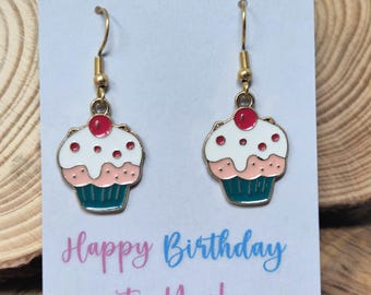 Enamel cupcake charms suspended on gold plated stainless steel wires. Birthday Earrings.