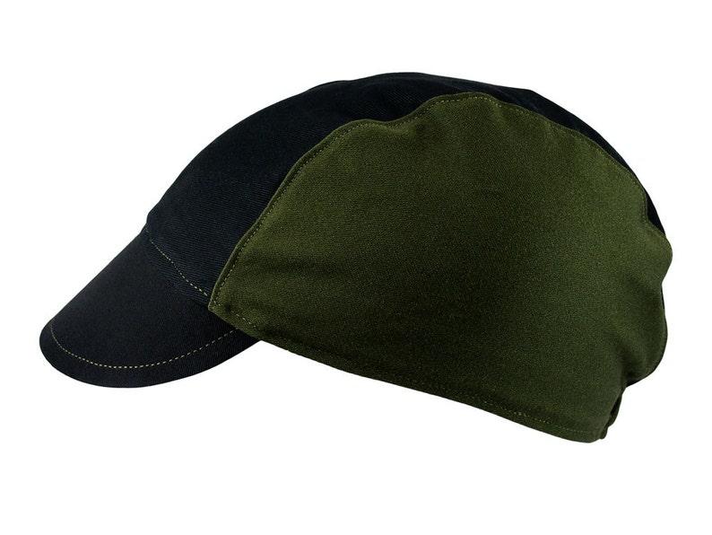 May include: A black and green baseball cap with a curved brim. The cap is made of a soft, durable fabric.