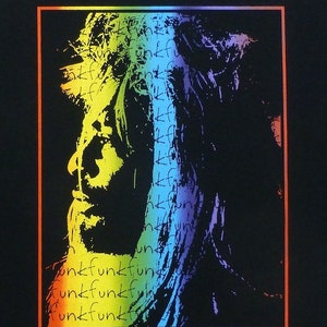 May include: A black t-shirt with a rainbow-colored image of a person's face. The image is made up of the word "funk" repeated many times.