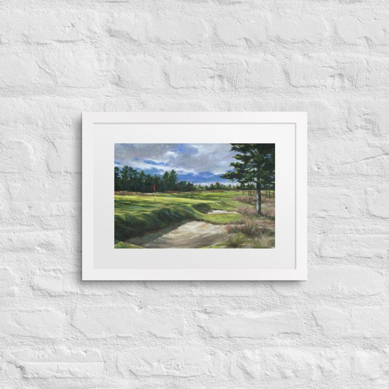 May include: A painting of a golf course with a green fairway, sand traps, and a flag in the distance. The sky is cloudy and there are trees in the background.