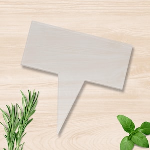 May include: A pale wooden plant marker in a speech bubble design. Fresh rosemary and basil sprigs are arranged on a light wood grain surface, suggesting a garden or culinary theme.