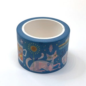 May include: A roll of blue washi tape with a repeating pattern of a cat, a flower, a cup, and stars.