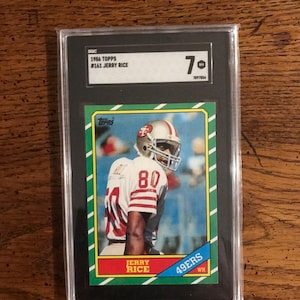 Jerry Rice Rookie 1986 Topps Football Card SGC 7 (As Pictured) (Original Issue) (4903)