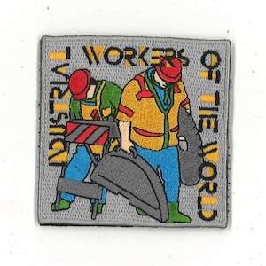 May include: Embroidered patch featuring two cartoon construction workers in yellow and green vests, red hats, and blue pants. The patch reads "Industrial Workers of the World" in yellow text.
