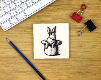 black and white rabbit in hat illustration coaster