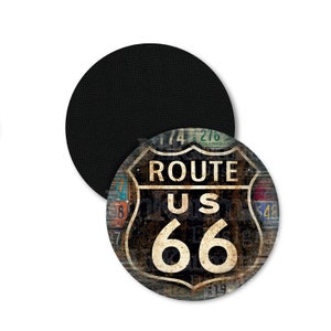 May include: A round, black and white sign with the text "ROUTE US 66" in a black shield shape. The sign is made of wood and has a distressed, vintage look. The background of the sign is made up of various license plates from different states.