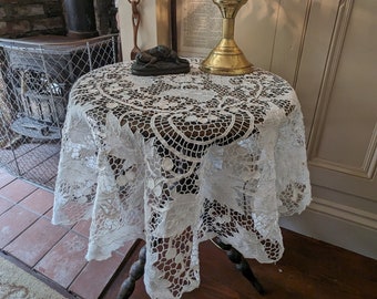 Antique handmade lace tablecloth, round