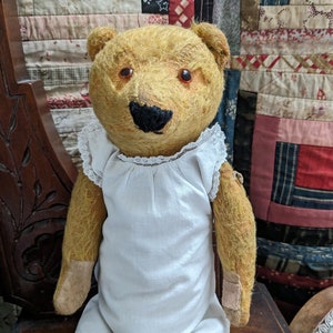 Antique stick bear in dress