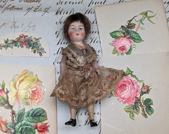 Antique dollhouse doll in original clothes
