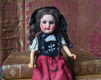 Small antique German doll, sleep eyes