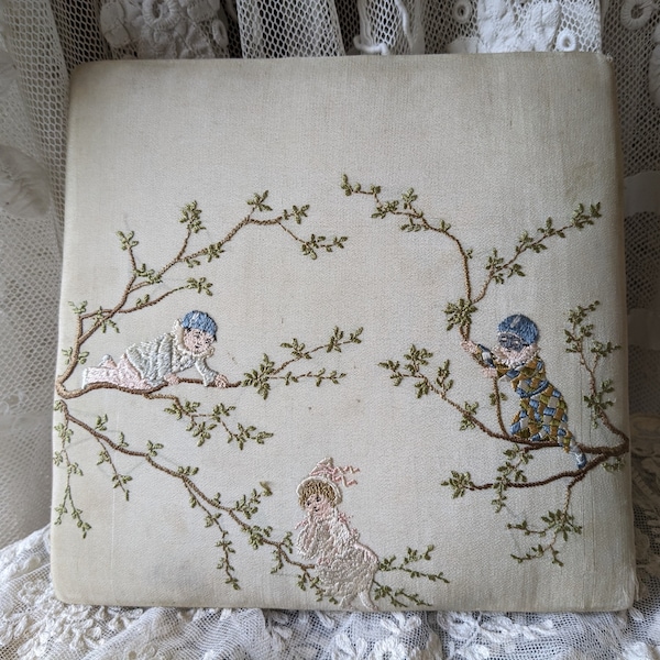 Antique fabric box with embroidered figures