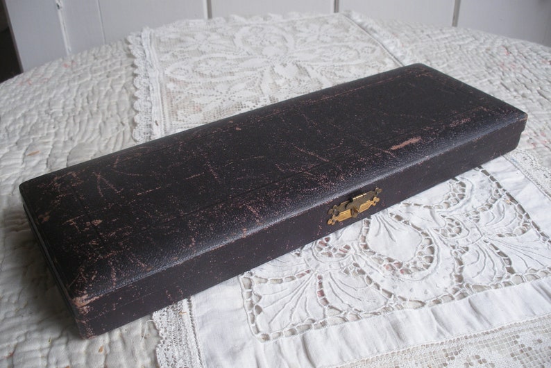 Antique bone handle fish servers in case