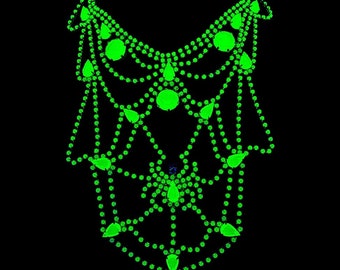 May include: A green rhinestone necklace with a layered design. The necklace features teardrop-shaped rhinestones and round rhinestones.