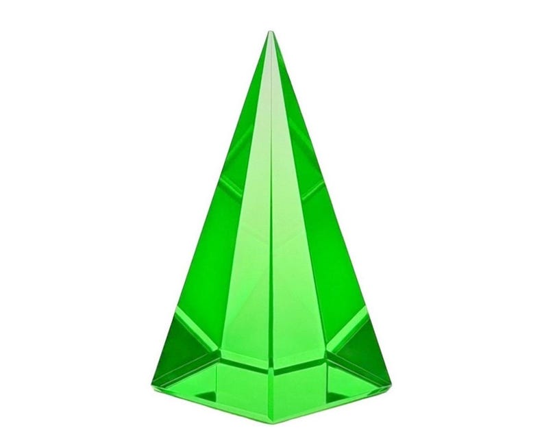 May include: A vibrant green, faceted glass pyramid. The pyramid has a flat square base and tapers to a sharp point. The transparent material allows light to pass through, creating a bright, eye-catching decorative object.